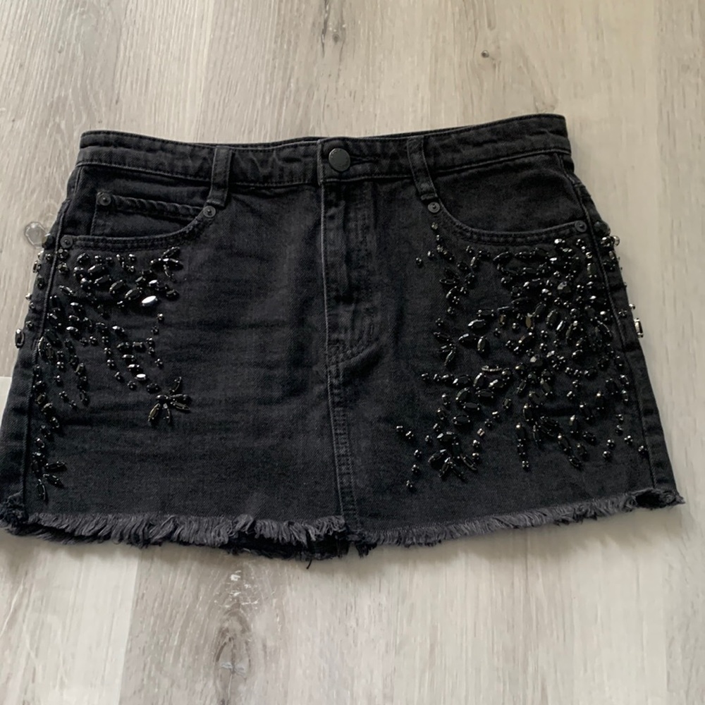 Embellished black denim skirt